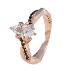 Angel brand blue halo gemstone ring with rose gold band and black accent stones