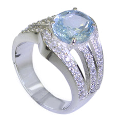 Luna blue halo ring with large light blue center stone and pave diamond split shank on silver band