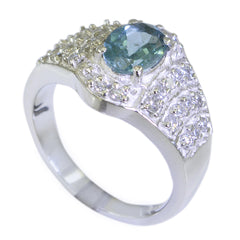 Kristine elegant blue halo ring for women with a central blue gemstone and surrounding clear crystals