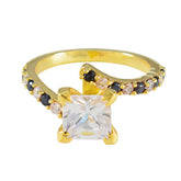Ines gold ring featuring a square clear center stone with black and white accent stones blue halo ring for women