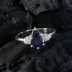 Ananya blue halo ring for women with pear shaped deep blue sapphire center and two side white stones on silver band