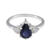 Ananya blue halo ring for women pear shaped deep blue center with two clear side stones on silver band