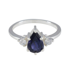 Ananya blue halo ring for women pear shaped deep blue center with two clear side stones on silver band