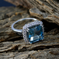 Lourdes blue halo ring for women cushion cut blue center stone with diamond halo in white gold setting