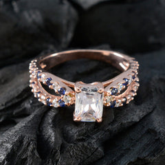 Sakura blue halo ring for women with rose gold band and sparkling white and blue stones