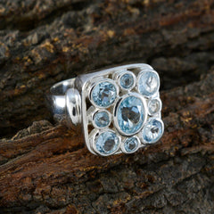 Josephine blue navratna ring silver square cluster with multiple light blue gemstones on textured wood