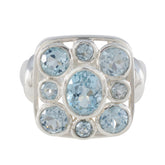 Josephine blue navratna ring sterling silver with central oval aquamarine and eight round pale blue gemstones
