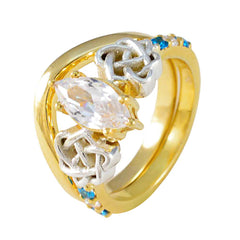 Ella gold ring featuring a blue penta gemstone ring design with intricate silver accents
