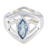 Autumn blue solitaire art deco ring with marquise cut blue gemstone in silver setting
