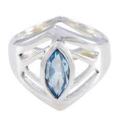 Autumn blue solitaire art deco ring with marquise cut blue gemstone in silver setting