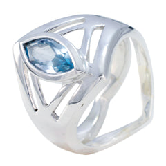Autumn blue solitaire art deco ring with marquise-cut blue gemstone and open silver band design