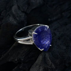 Lourdes blue solitaire gemstone ring with a pear-shaped deep blue stone set in silver band