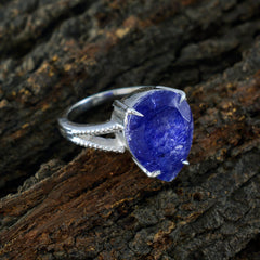 Lourdes blue solitaire gemstone ring with pear-shaped blue stone set in silver band
