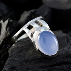 Yasmin blue solitaire gemstone ring with polished silver band and oval cabochon stone