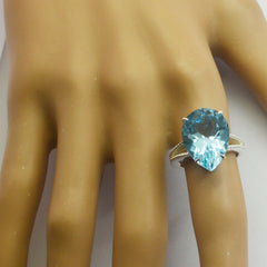 Paula blue solitaire gemstone ring with pear-shaped blue gemstone on silver band