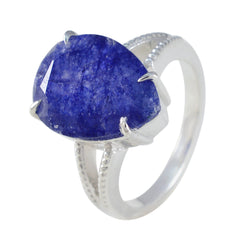 Lourdes blue solitaire gemstone ring with a large deep blue stone and silver band detailing