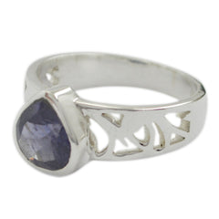 Maria blue solitaire heart ring with silver band and intricate cutout design