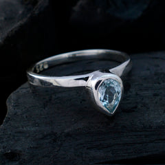 Natcha elegant blue solitaire ring with teardrop shaped gemstone set in silver band