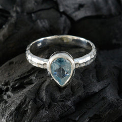 Riya blue solitaire ring for women with pear-shaped blue gemstone and textured silver band