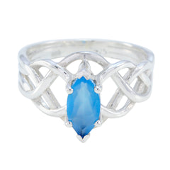 Carla blue solitaire ring for women with silver intertwined band and marquise blue gemstone