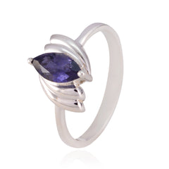 Camila blue solitaire ring with marquise-cut blue gemstone set in silver band