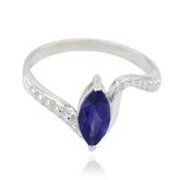 Meera blue solitaire ring with marquise-cut blue gemstone and silver band detailing