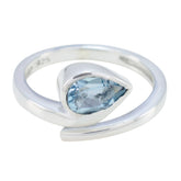 Violet blue solitaire ring with teardrop shaped blue gemstone set in sterling silver band