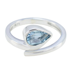 Violet blue solitaire ring with teardrop shaped blue gemstone set in sterling silver band