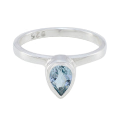 Natcha blue solitaire ring with pear-shaped blue gemstone set in silver band