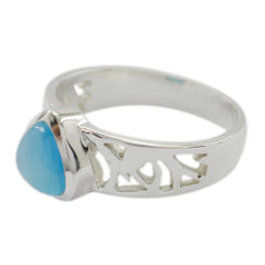 Maya silver ring with an intricate band design featuring a blue solitaire ring stone