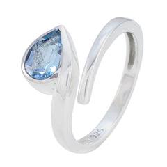 Violet blue solitaire ring with pear-shaped blue gemstone set in sterling silver band