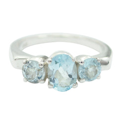 Kristine blue solitaire ring with three light blue gemstones set in silver band