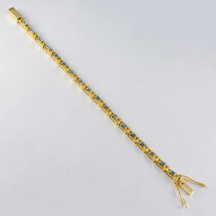 Katarina Blue Tennis Bracelet in Gold Tone