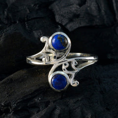 Antonia sterling silver ring with two deep blue stones and ornate scrollwork blue toi et moi ring