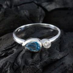 Nora sterling silver ring with pear blue gemstone and small bezel diamond blue toi et moi ring