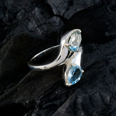 Claire silver ring blue toi et moi ring with two blue gemstones in marquise and oval cuts on polished band