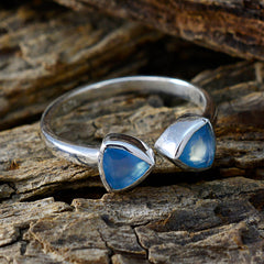 Sakura sterling silver open band blue toi et moi ring with two triangular blue cabochon stones on wood