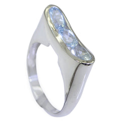 Eleanor silver band blue trilogy gemstone ring with three oval light blue stones in bezel setting