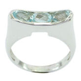 Eleanor silver band blue trilogy gemstone ring with three oval aquamarine stones in bezel setting