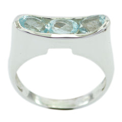 Eleanor silver band blue trilogy gemstone ring with three oval aquamarine stones in bezel setting