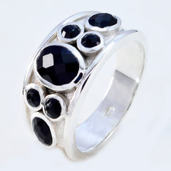Isla boho black gemstone ring with multiple faceted black stones set in wide silver band