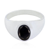 Camila boho black solitaire ring with a polished silver band and oval black stone centerpiece