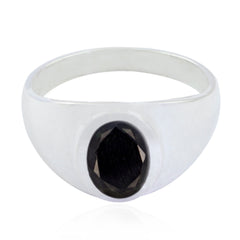 Camila boho black solitaire ring with a polished silver band and oval black stone centerpiece
