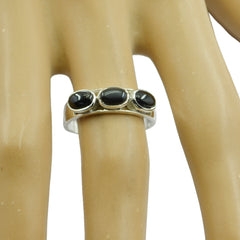 Lea boho black trilogy ring with three oval black stones set on silver band