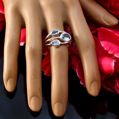 Katharina boho blue gemstone ring with three blue stones on silver band on mannequin hand