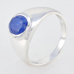 Autumn boho blue solitaire ring with a round blue stone set in polished silver band