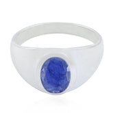 Autumn boho blue solitaire ring with a polished silver band and oval blue gemstone centerpiece