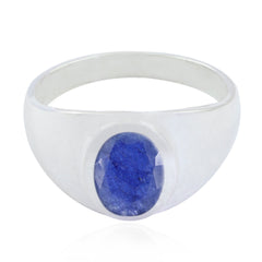 Autumn boho blue solitaire ring with a polished silver band and oval blue gemstone centerpiece