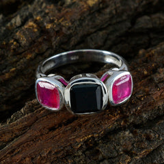 Micaela boho gemstone trilogy ring with a black center stone and two pink side stones on silver band