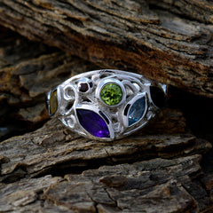 Isabel boho multicolor gemstone ring featuring green, purple, blue, and black stones in silver setting